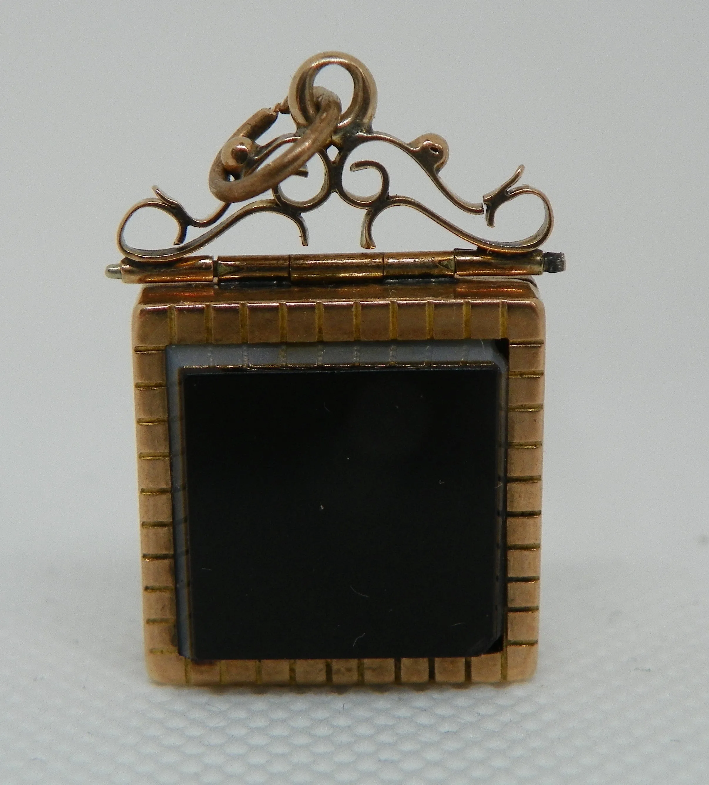 Victorian Locket Box. Gold Filled. Tiger's Eye Carved with Figure and Onyx Back.